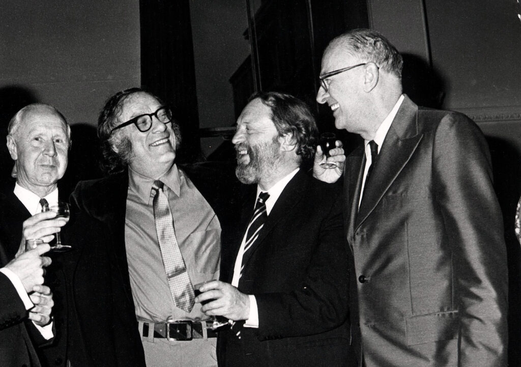 4 men, from left to right: unknown, Isaac Asimov, unknown, Arthur C. Clarke
